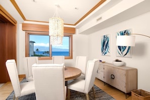 Hale-Honu-At-Montage-Kapalua-Bay Seashell chandelier sparkles above, while the view beyond the window sings lullabies only the ocean knows
