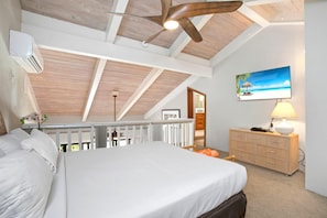 PKC-403 Vaulted ceilings and cozy corners make this loft suite a restful haven for family or friends to unwind : Master Bedroom