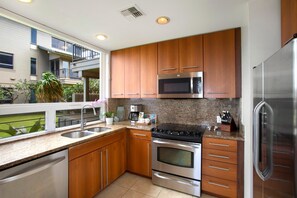 KBV-31G4 This sunlit kitchen is perfect for flipping pancakes, pouring bubbly, or just admiring the view while your toast pops