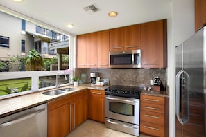 KBV-31G4 This sunlit kitchen is perfect for flipping pancakes, pouring bubbly, or just admiring the view while your toast pops