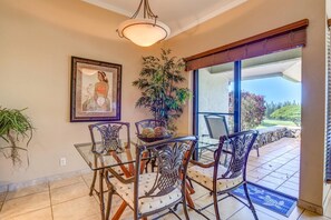 KGV-17P7 Surrounded by floor-to-ceiling windows and palm-kissed light, this stylish dining nook invites laughter, connection, and fresh flavors