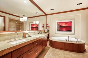 Hale-Moana-At-Montage-Kapalua-Bay Indulge in spa-like luxury with a deep soaking tub and marble finishes