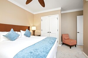 HKH-406 Soft palettes, airy drapes, and just the right hint of ocean in the distance make this room a guest favorite: Master Bedroom
