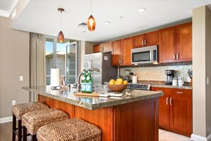 HKH-406 This bright, open kitchen invites you to slow down, sip something good, and savor every moment around the island