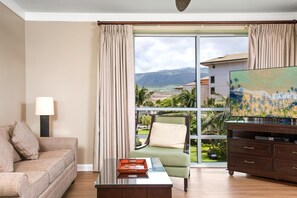 HKH-406 Bask in natural light and mountain views from this sleek, peaceful living room with soft tones and modern charm