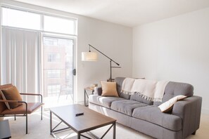 Spacious living room with private balcony