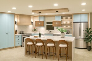 Open concept kitchen, living and dining room w/ beautiful ocean view from walk-out patio