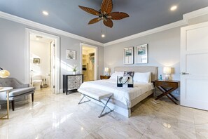 Primary bedroom with king sized bed, walk-in closet & ensuite bathroom. Bathrobes & slippers are provided for guests, as well as a complimentary custom beach bags for our guests to take home.
