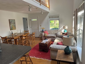 Open living area, lightened by an atrium.