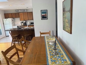 Table for four next to breakfast bar for two.