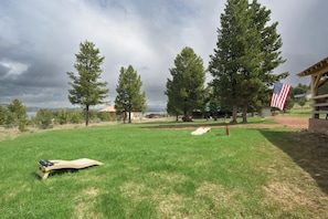 This oversized backyard has room for yard games (provided)