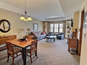 Dining and living area with pull out sofa | Listed with @BookTraverse