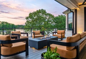 Gather with friends around the fire pit and soak in magical sunset views from this elevated, modern deck space.