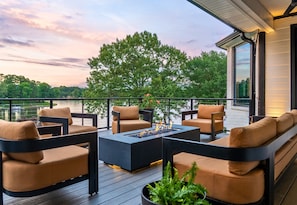 Gather with friends around the fire pit and soak in magical sunset views from this elevated, modern deck space.