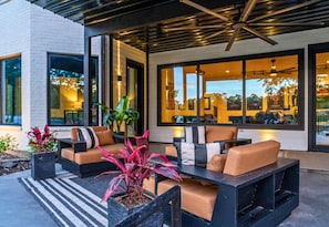 Sleek design meets cozy comfort in this stylish outdoor lounge—perfect for morning coffee or evening cocktails.