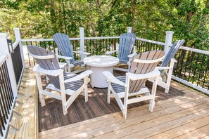Step outside the screened in porch to this open air patio for drinks, dining or the cool shade and breeze.