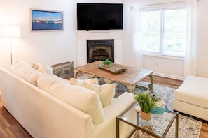 Live it up in the living room with ample seating and 70" smart TV!