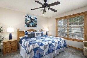 Relax in comfort in this cozy bedroom with a luxurious king bed. Luxury mattresses at the Whitetail Lodge are NEW, ensuring a restful and rejuvenating night's sleep. Your comfort is our priority, making this the ideal retreat for relaxation and renewal.