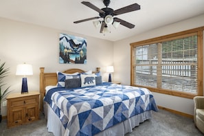 Relax in comfort in this cozy bedroom with a luxurious king bed. Luxury mattresses at the Whitetail Lodge are NEW, ensuring a restful and rejuvenating night's sleep. Your comfort is our priority, making this the ideal retreat for relaxation and renewal.