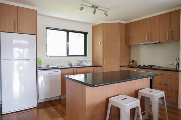 Kitchen: With dishwasher, fridge/freezer, microwave, tea,coffee, sugar, milk.