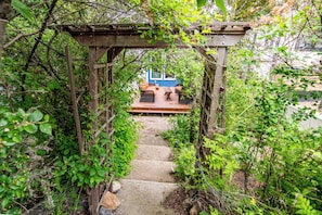 Peek-a-boo. Beautiful oasis in the front of the property to relax.