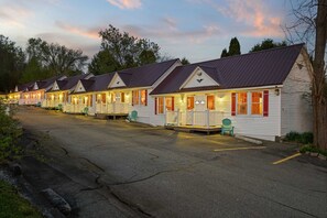 The Littleton Motel at dusk, glowing with charm and ready to welcome you home after a day of exploring.