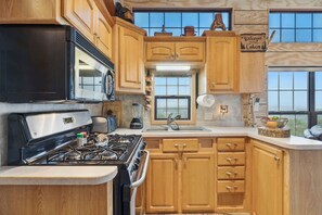 Fully equipped kitchen with everything you need to cook, serve and enjoy meals at home