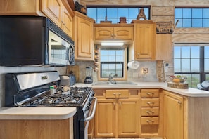 Fully equipped kitchen with everything you need to cook, serve and enjoy meals at home