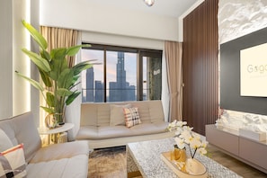 Stylish living room with a view of the city skyline and natural light.