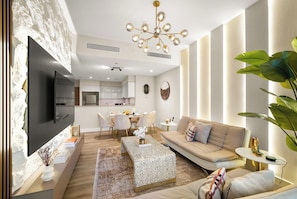 Open-plan living and dining area with elegant furnishings and cozy vibes.