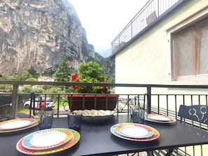 Furniture, Table, Chair, Kitchen & Dining Room Table, Mountain Range, Restaurant, Outdoor Table, Outdoor Furniture, Coffee Table, Balcony