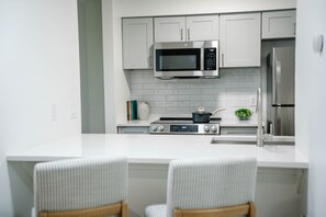 Convenient bar seating connecting the kitchen and living room.