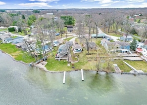 Aerial view of yellow cottage (center) and grounds