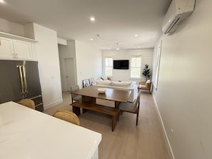 Open-concept kitchen, dining, and living space designed for comfort and connection.