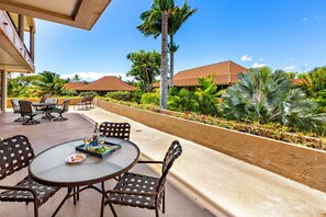 Enjoy the peaceful island breeze on the shared lanai—perfect for morning coffee or an evening wind-down.