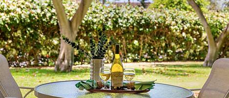 Relax on your private lanai overlooking the lush, tropical gardens—perfect for morning coffee or evening relaxation.