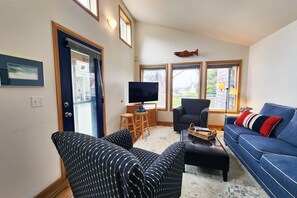 Enjoy all of the light and comfy seating in the living room.