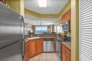 Cook with a view in the updated kitchen featuring stainless steel appliances