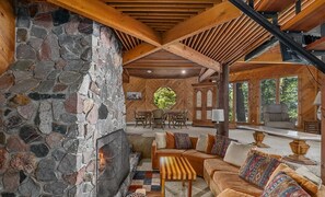 Fireplace sunken conversation pit is hub of main living area.
