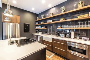Kitchen: Main floor, drip coffee maker, toaster, blender, kettle, cooking utensils, tableware