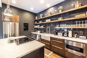 Kitchen: Main floor, drip coffee maker, toaster, blender, kettle, cooking utensils, tableware