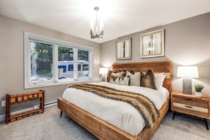 Bedroom 2: King bed, main floor, en-suite bathroom with steam shower, built-in TV