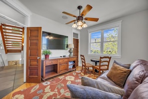 Living room 2: Main floor, Secondary sitting area, natural light, Smart TV