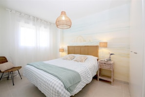 Master bedroom with king-size bed and en-suite bathroom