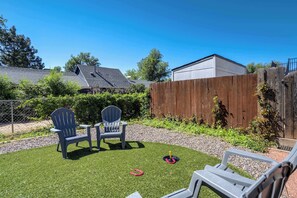 Relax in your own private backyard space with comfortable seating and a game of ring toss—perfect for soaking up sunny Colorado days

