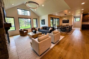 Kick back and relax in the living room, taking advantage of the inviting seating, a large smart TV, and a cozy gas fireplace.