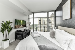 Bedroom 2 with comfortable King Bed, pack n play crib and en-suite bathroom (walk-in shower)