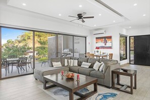 The open concept layout creates a seamless transition between the interior and exterior spaces.