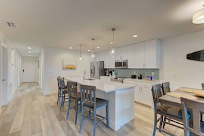 Full Kitchen with four bar stools