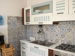 Kitchen, Major Appliance, Flooring, Tile, Countertop, Kitchen Appliance, Cabinetry, Sink, Kitchen Stove, Plumbing Fixture